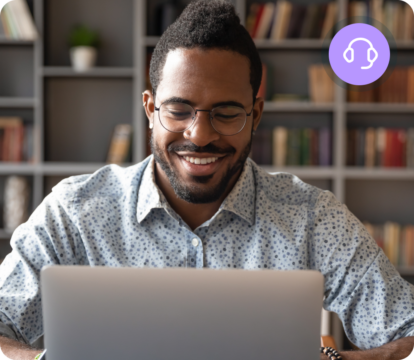 Man with glasses working on laptop, purple circle with white headphones icon