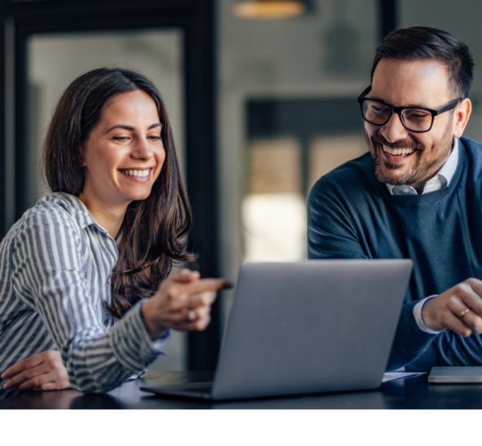 Man with glasses and woman working on laptop, green and purple gear icon, navy square with green laptop icon